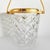 Crystal ice bucket with a 24-karat gold-plated handle and decorative rim. Origin: circa 1950s, Belgium. Probably...