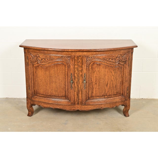 A gorgeous French Provincial Louis XV style bow front sideboard, buffet server, or bar cabinet By Minton Spidell USA, Late...