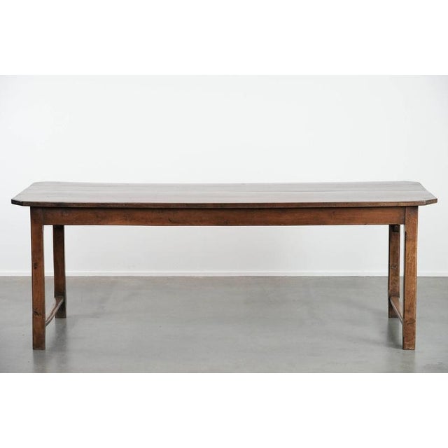 This beautiful antique French dining table for 4 to 6 people from the late 18th/early 19th century with an oak top, a...