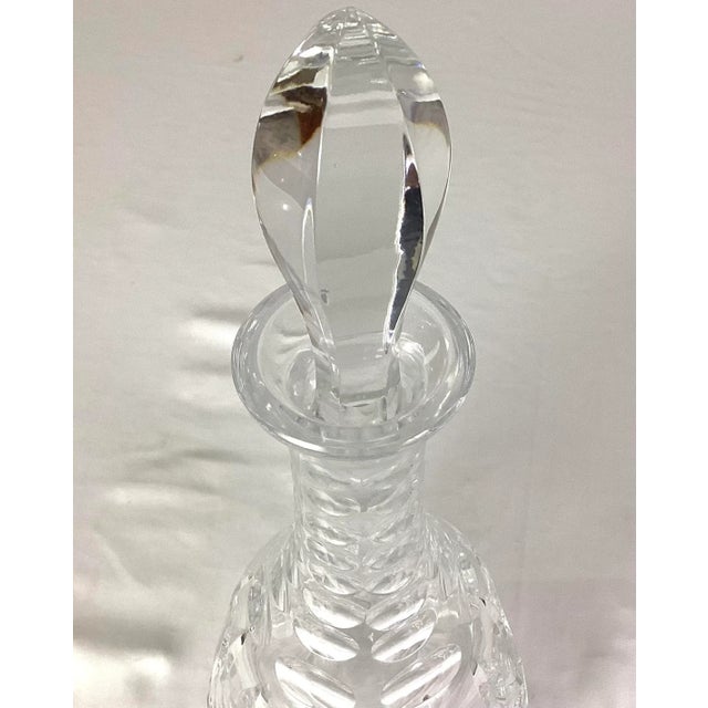 Cut crystal decanter - imported from Germany With a matching faceted stopper Featuring a realistic fan and leaf cut...