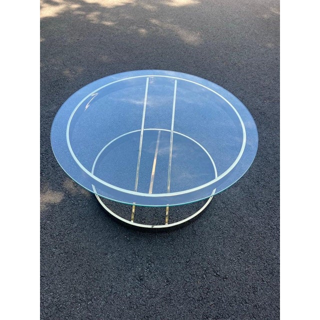 Mid Century Round Brass and Glass Table attributed to Milo Baughman. Classic design . Glass is removable . Attributed to:...