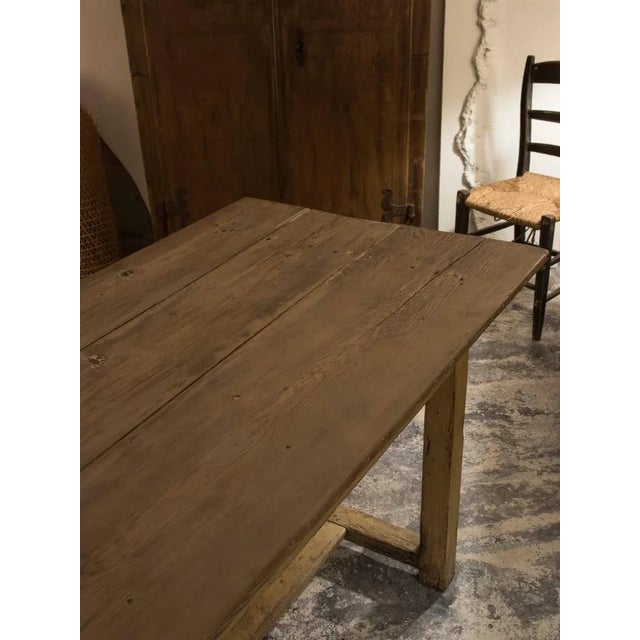 Dining table in a fir in original khaki color patina. The table was purchased in the south of France and dates back to the...