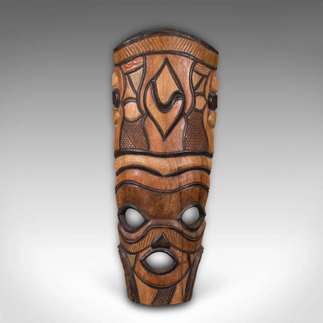 This is a tall vintage tribal mask. A Central African, decorative cultural ornament, dating to the late 20th century,...