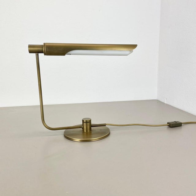 Origin: Switzerland Producer and Design: Rosemarie and Rico Baltensweiler attrib. Decade: 1970s This table light is...