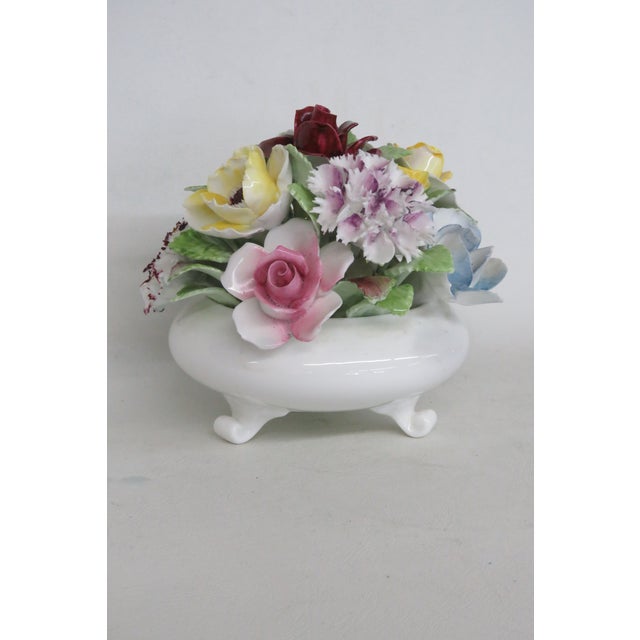 This gorgeous Floral Posy is made of bone china. This darling collectible is marked on the bottom with the following...