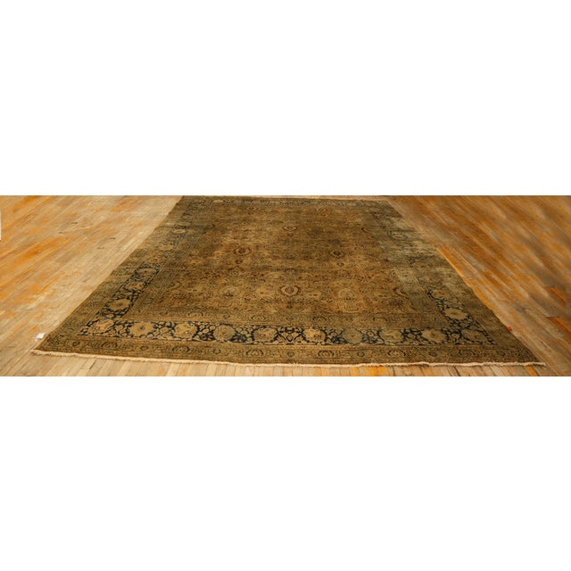 "This elegant Antique Persian Mashad rug, dating to circa 1900, is a sophisticated example of Khorassan weaving artistry....
