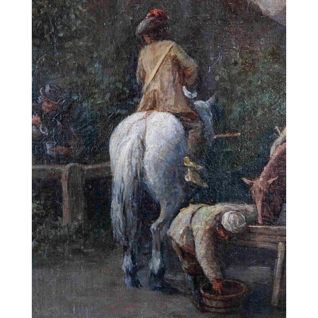 A finely executed 18th century Flemish oil on canvas depicting a tranquil suburban village road animated by figures,...