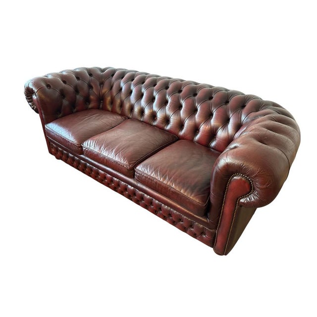 Chesterfield group/set. Containing of a three-seater, two-seater & an armchair. Genuine leather with deep button...