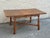 Solid wood construction with warm medium-tone finish. Dining table with turned legs and stretcher base, expands with a...