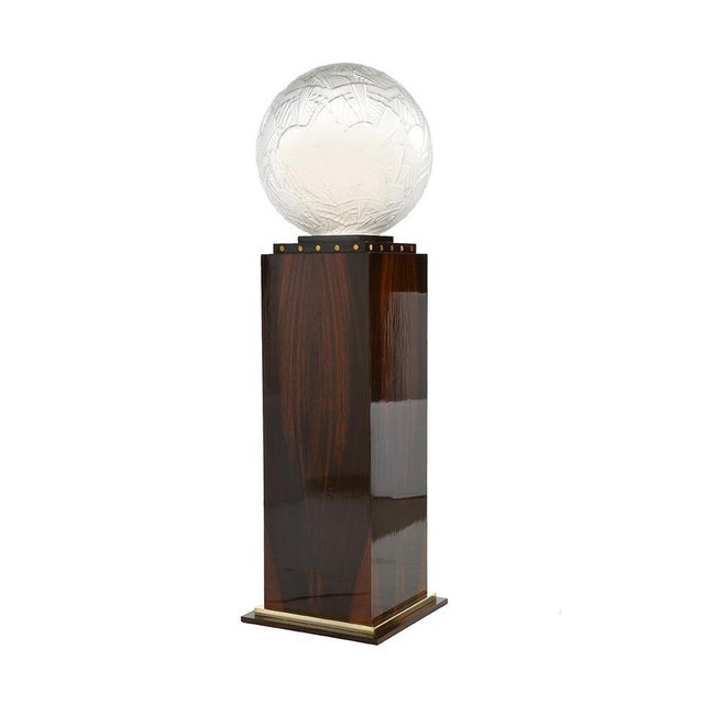 Glass ball molded Sabino (1878 - 1961) arranged on its luminous column in wood and brass made to measure. Object of...