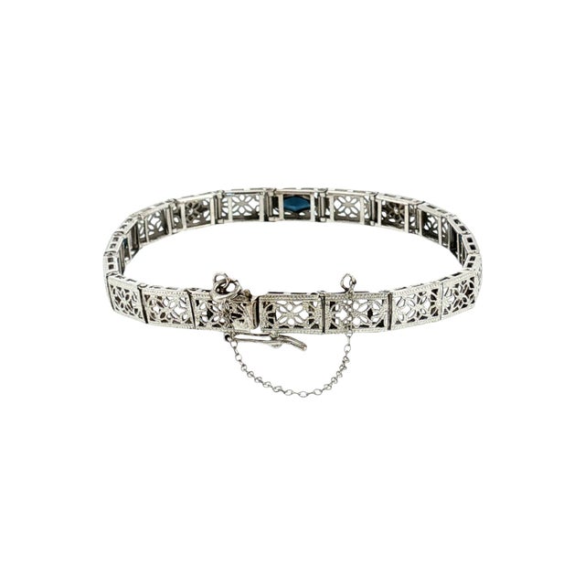 A 1930's depression filigree link bracelet. Crafted in 14k gold, this piece features intricate openwork designs. The...