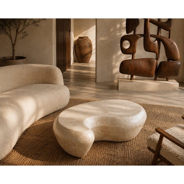 Bring timeless elegance and sculptural beauty into your home with this handmade Wabi Sabi coffee table, designed for...