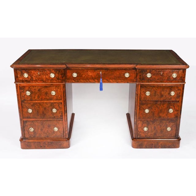 This is a fine antique Victorian burr walnut twin pedestal desk, Circa 1860 in date. It is made from fabulous burr walnut....
