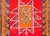 A bold and brilliant mid-20th century Turkish rug with four large stylized floral medallions woven in vibrant pinks,...