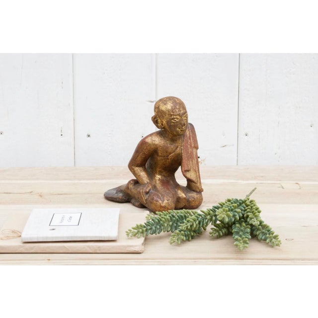 This vintage Buddhist monk carved statue from Burma is a work of art. Its hand carved in wood with a gilded and rouge...