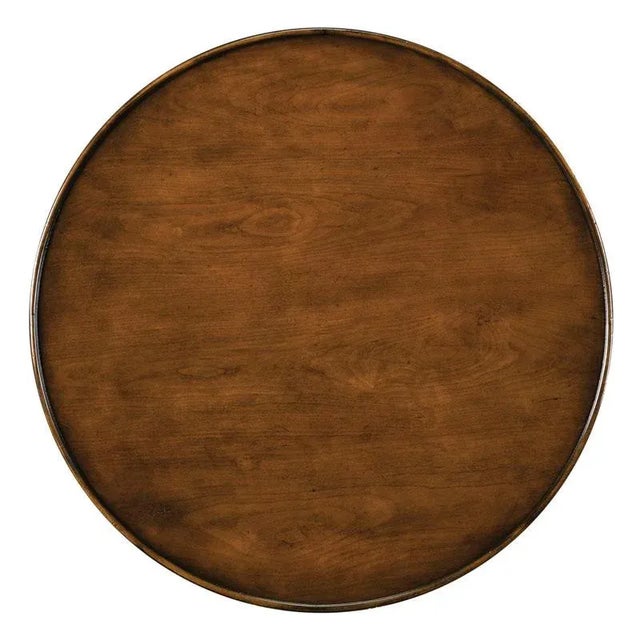 A lovely table styled in the fashion of the late 18th Century French Directoire period. A round galleried top rests over...