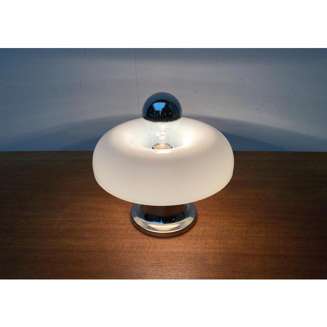 Mid Century Mushroom table lamp. The small lamp consists of one foot made of metal and a ring -shaped diffuser hood made...