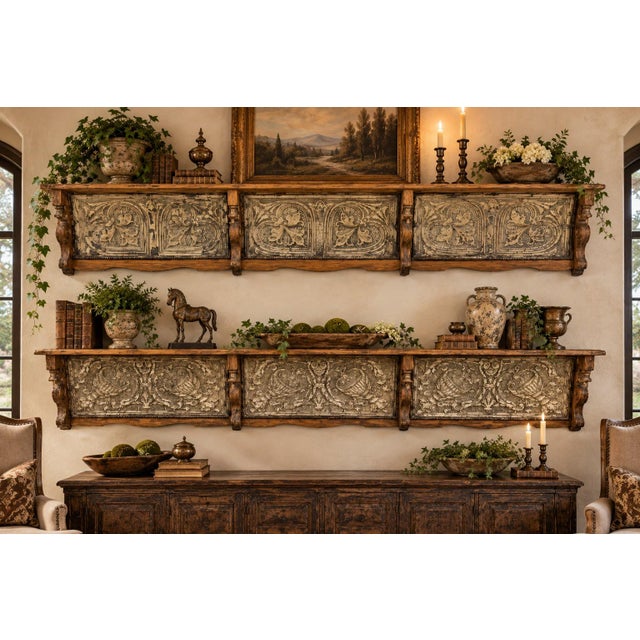 A striking pair of oversized vintage wall shelves combining richly distressed wood with beautifully detailed pressed tin...