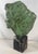 Original Alva Museum Replicas foil label on felt base. Profile bust of a woman with windswept hair by Peggy Mach,...