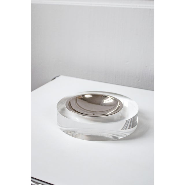 This 1970s valet tray, designed by Italian designer Felice Antonio Botta, combines a transparent acrylic glass base with a...