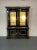 Hollywood Regency Maison Jansen Style Bookcase / China Cabinet, Ebony, Gold Leaf A stunning refinished cabinet having two...