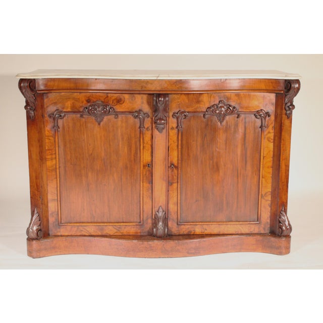 English Victorian burl walnut and walnut cabinet with marble top, circa 1880. With a serpentine shaped white marble top...