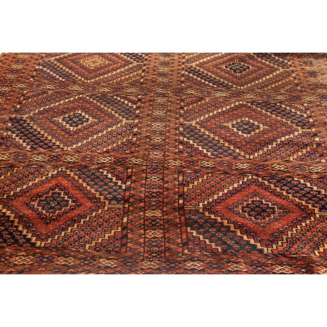 This captivating antique Caucasian rug, woven around 1900, is a masterful expression of tribal artistry and geometric...