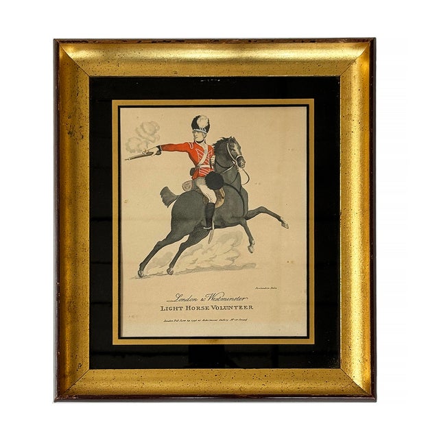Pair of vintage framed English soldiers on horseback prints. Soldier print (Red coat) reads 'London - Westminster Light...