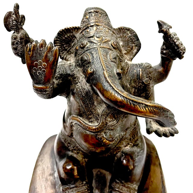 Antique asian cast bronze sculptural figure of the Hindu god - Lord Ganesha. Defining a specific origin for such a piece...