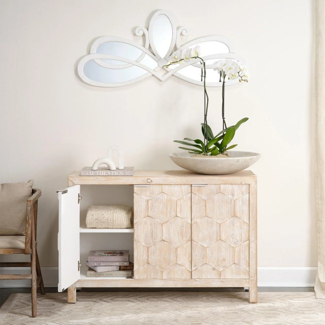 Create a focal point in your home with this stunning mirror featuring a scroll design. Featuring beveled glass surrounded...