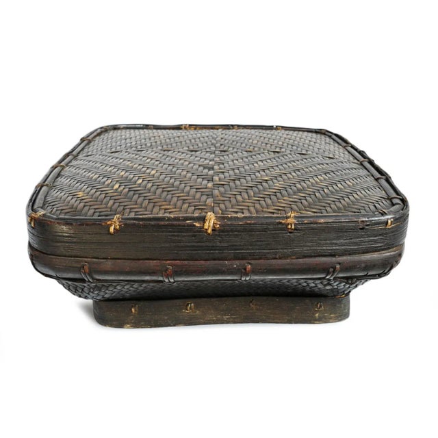 Vintage Akha hill tribe basket from Northern Thailand. Beautiful handwoven bamboo storage vessel featuring a softly...