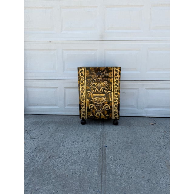 We have a super unique, very beautiful vintage black and gold Neoclassical storage chest for sale. It features an...