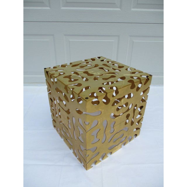 An eye-catching metal puzzle cube, with a thick glass top, attributed to Tri-Mark. The cube is 17 inches in width, depth,...