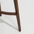 A 19th century English side table crafted in mahogany, featuring a narrow rectangular top and slender support legs. The...