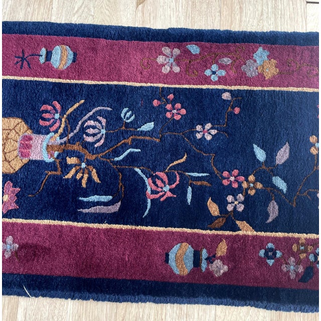 This striking antique Chinese rug is a quintessential example of the Art Deco movement from the 1920s. Unlike traditional...
