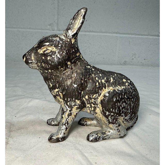 This rare antique 1920's Cast Iron bunny still bank by A.C. Williams is a unique and collectible piece with an exquisite...