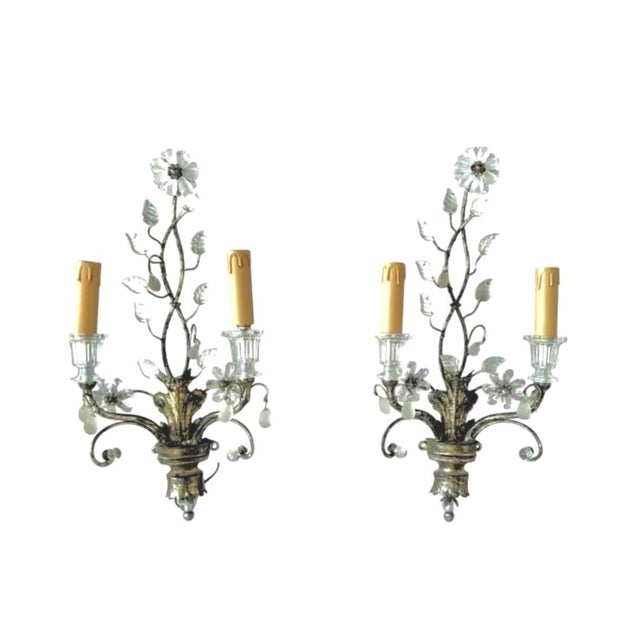 Pair of Baques Style Silver-Leaf Wall Sconces. Sconces are in the style of Maison Basques and feature a hand-worked silver...