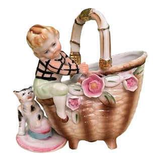 Vintage Porcelain Figurine of Boy Climbing on Basket For Sale