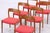 Vintage chair model 75 by Niels Otto Møller, made of teak with a classically curved backrest and upholstered seat. Offered...