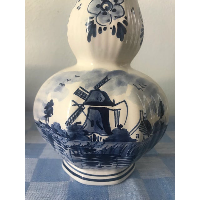 You can’t go wrong with a beautiful hand painted Deft vase! Signed on the bottom. Age unknown.