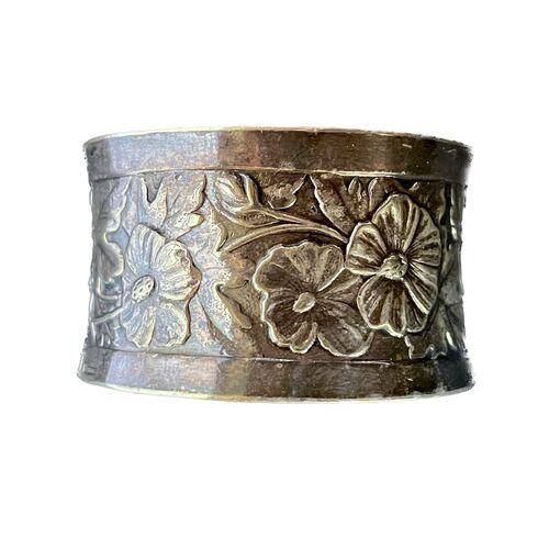 Vintage silver Christofle floral and shield napkin ring. Depicts embossed shield and floral design. Marked "Christofle" on...