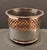 1920s English silver on copper wine coaster, cylindrical form with a pierced upper section and a wooden baize covered...