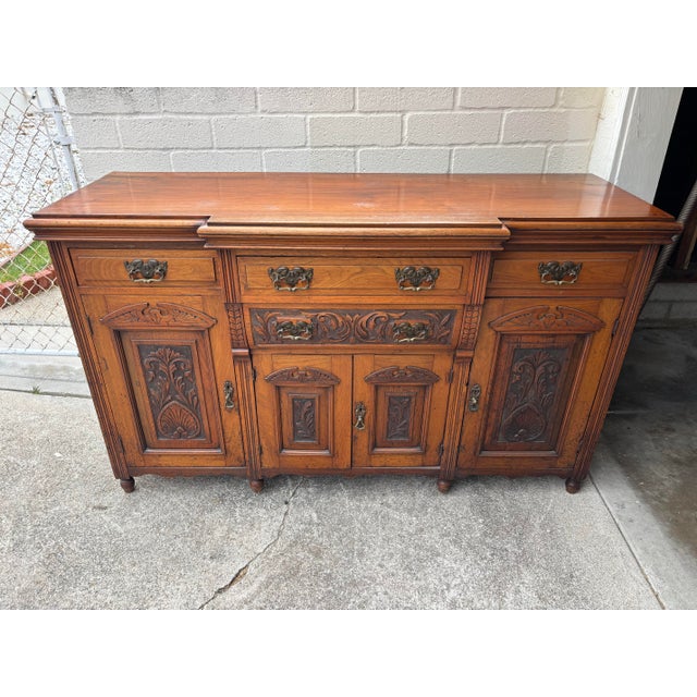 Victorian Antique Victorian Walnut Sideboard Featuring Intricate Hand Carvings and Original Ornate Brass Hardware For Sale - Image 3 of 12