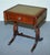 Antiques of London This elegant Regency-style side table features a rich hardwood frame with a gold-tooled green leather...