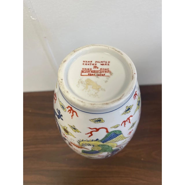 Striking hand-painted vintage Cantonware porcelain featuring intricate dragon and peacock designs. Richly detailed with...
