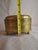 This elegant oval brass box is a charming relic of 19th-century craftsmanship. Historically utilized as a personal tobacco...