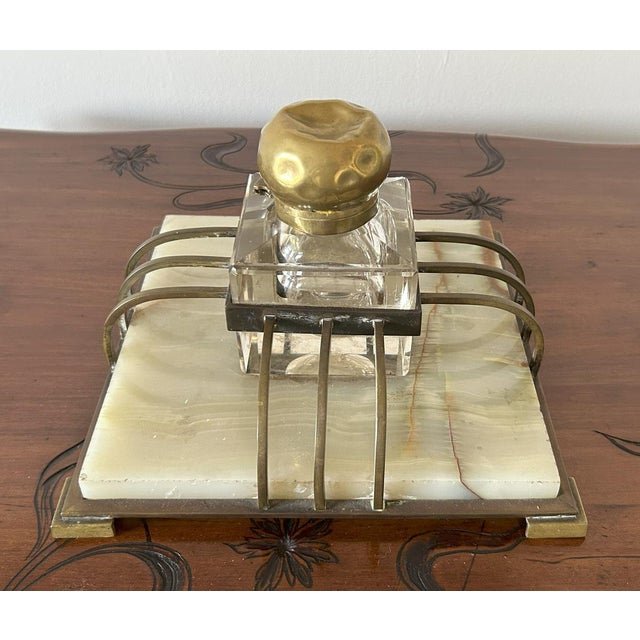 Elevate your workspace with the authentic elegance of the "Roaring Twenties." This exquisite antique inkstand, likely of...