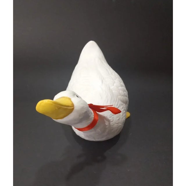 This cute little white duck figurine is a vintage piece that stands at 4 inches tall and 7 inches long. It has a matte...