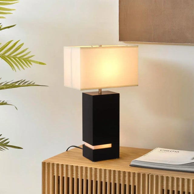 Elevate your living room with the captivating Zen table lamp featuring an espresso and brushed nickel finish that features...