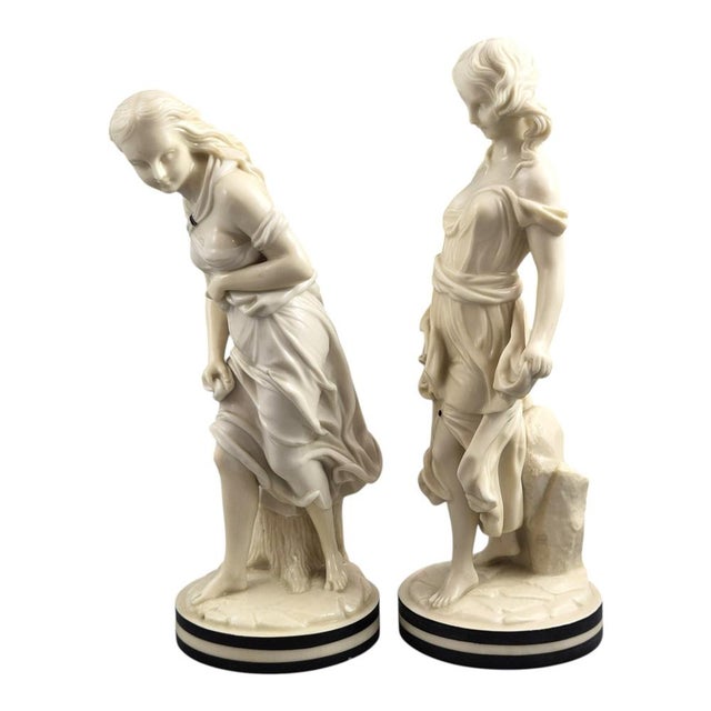 A highly decorative pair of Victorian Royal Worcester porcelain figures from the celebrated “The Breezes” series, modelled...